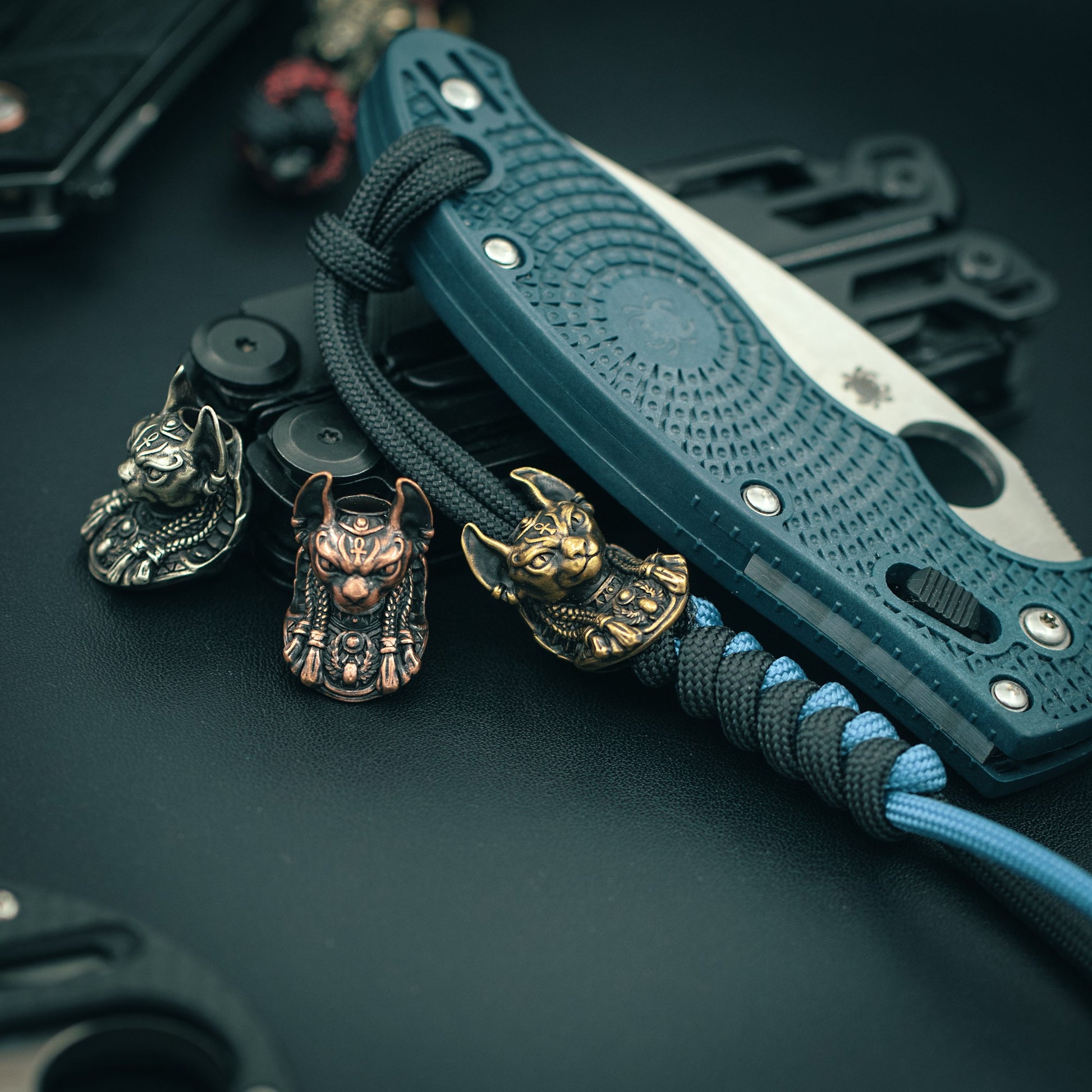 Bastet Egyptian Goddess paracord bead attached to a tactical paracord, enhancing EDC aesthetics and functionality.