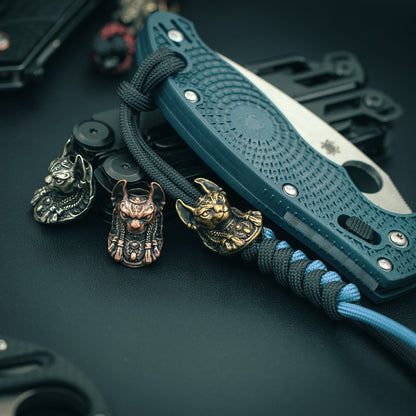 Bastet Egyptian Goddess paracord bead attached to a tactical paracord, enhancing EDC aesthetics and functionality.