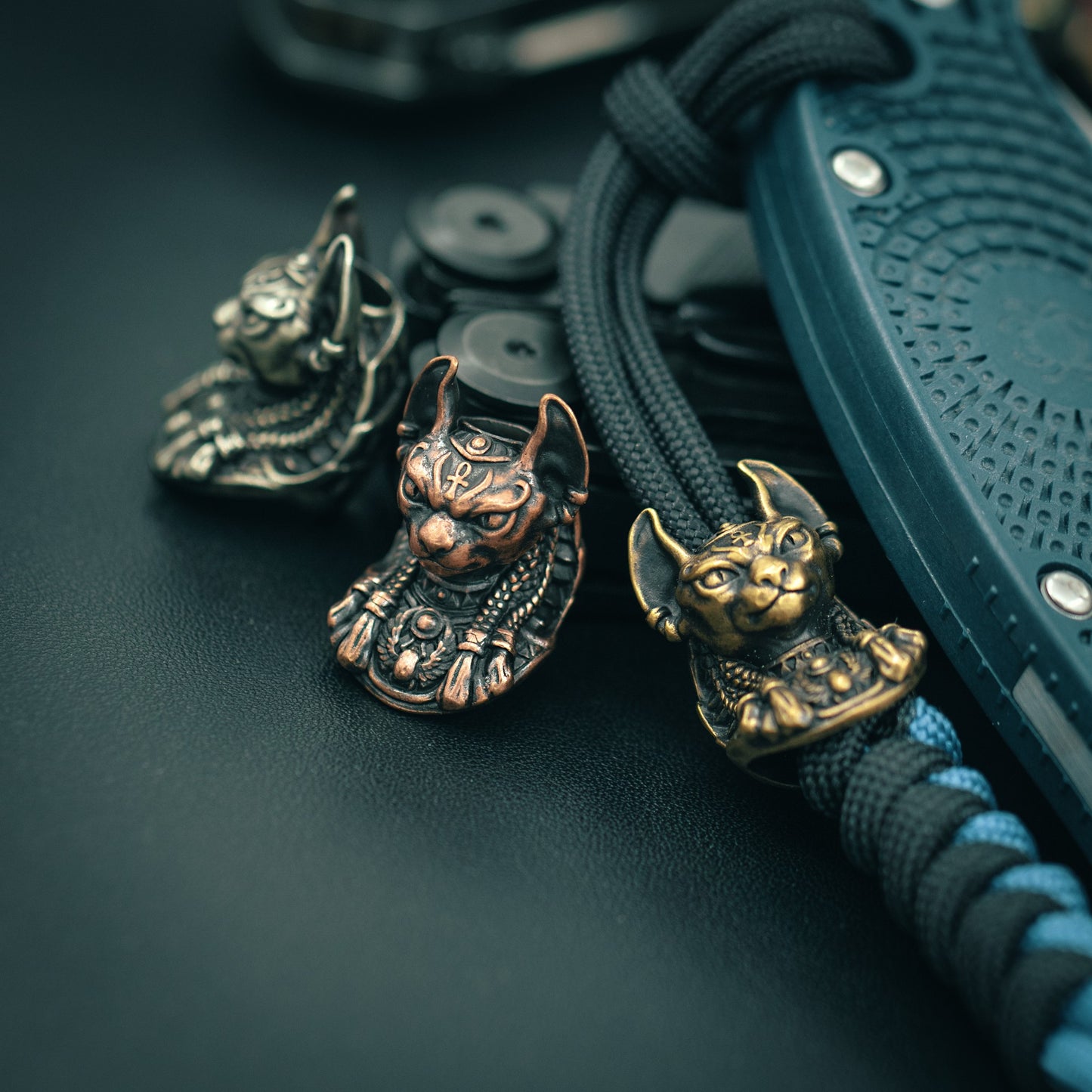 Top view of the handcrafted Bastet paracord bead, showcasing fine craftsmanship and bold design for collectors and outdoor enthusiasts.