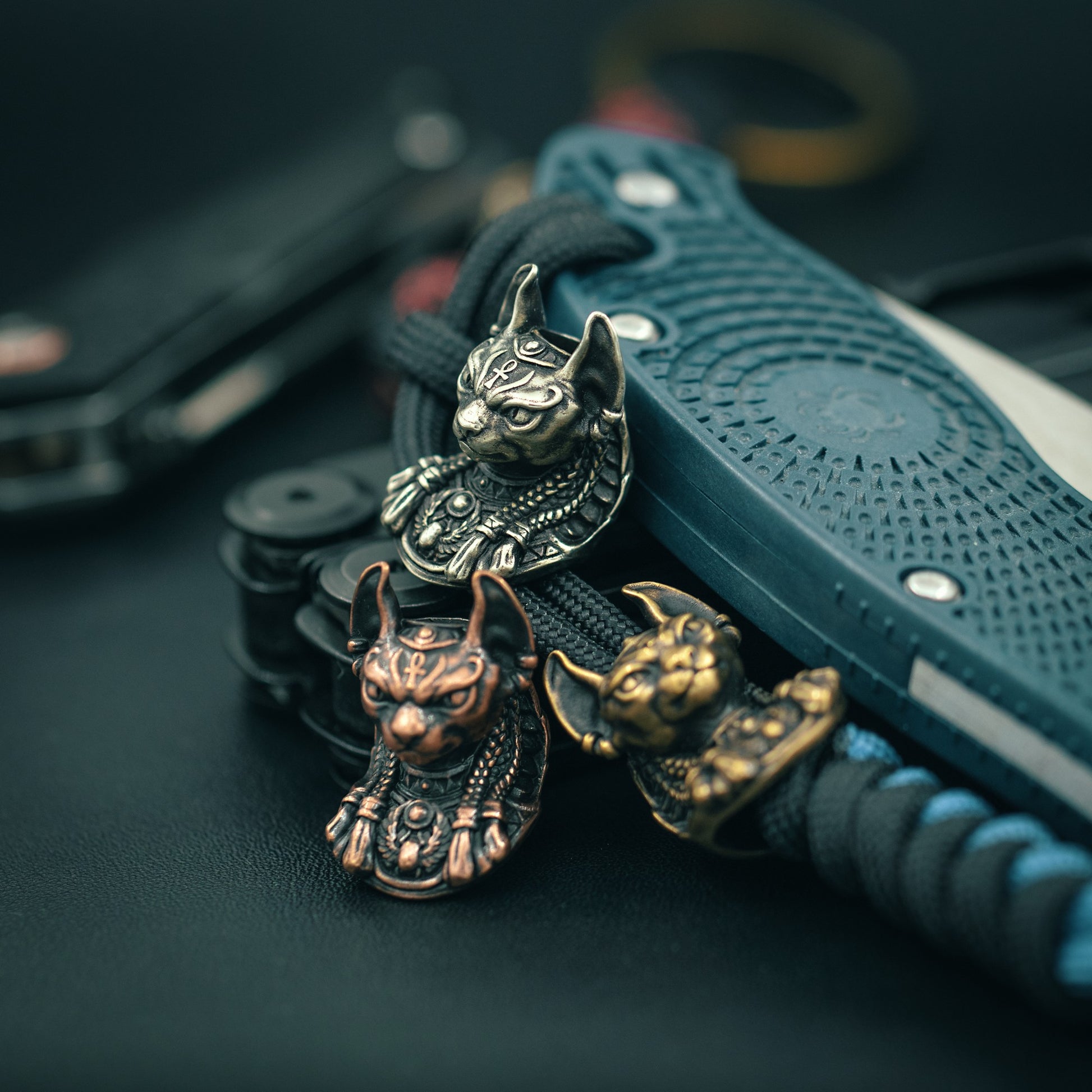 Top view of the handcrafted Bastet paracord bead, showcasing fine craftsmanship and bold design for collectors and outdoor enthusiasts.