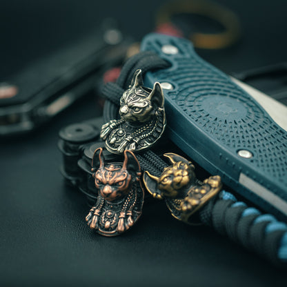 Top view of the handcrafted Bastet paracord bead, showcasing fine craftsmanship and bold design for collectors and outdoor enthusiasts.