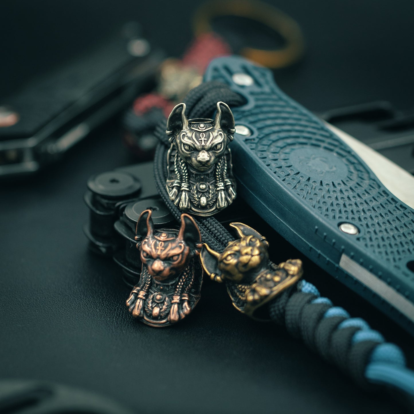 Top view of the handcrafted Bastet paracord bead, showcasing fine craftsmanship and bold design for collectors and outdoor enthusiasts.