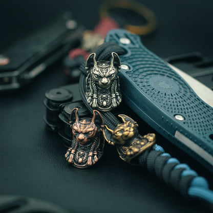 Top view of the handcrafted Bastet paracord bead, showcasing fine craftsmanship and bold design for collectors and outdoor enthusiasts.