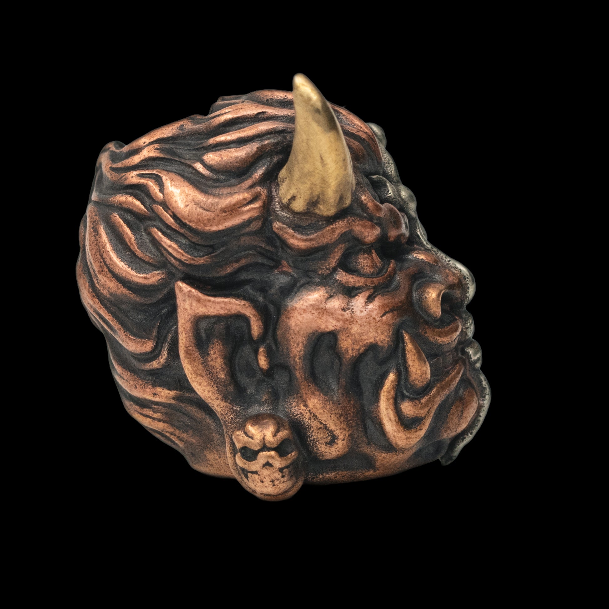 Buddha or Devil Paracord Bead three different metals edc right side — copper, brass, and white brass — fused together into a single