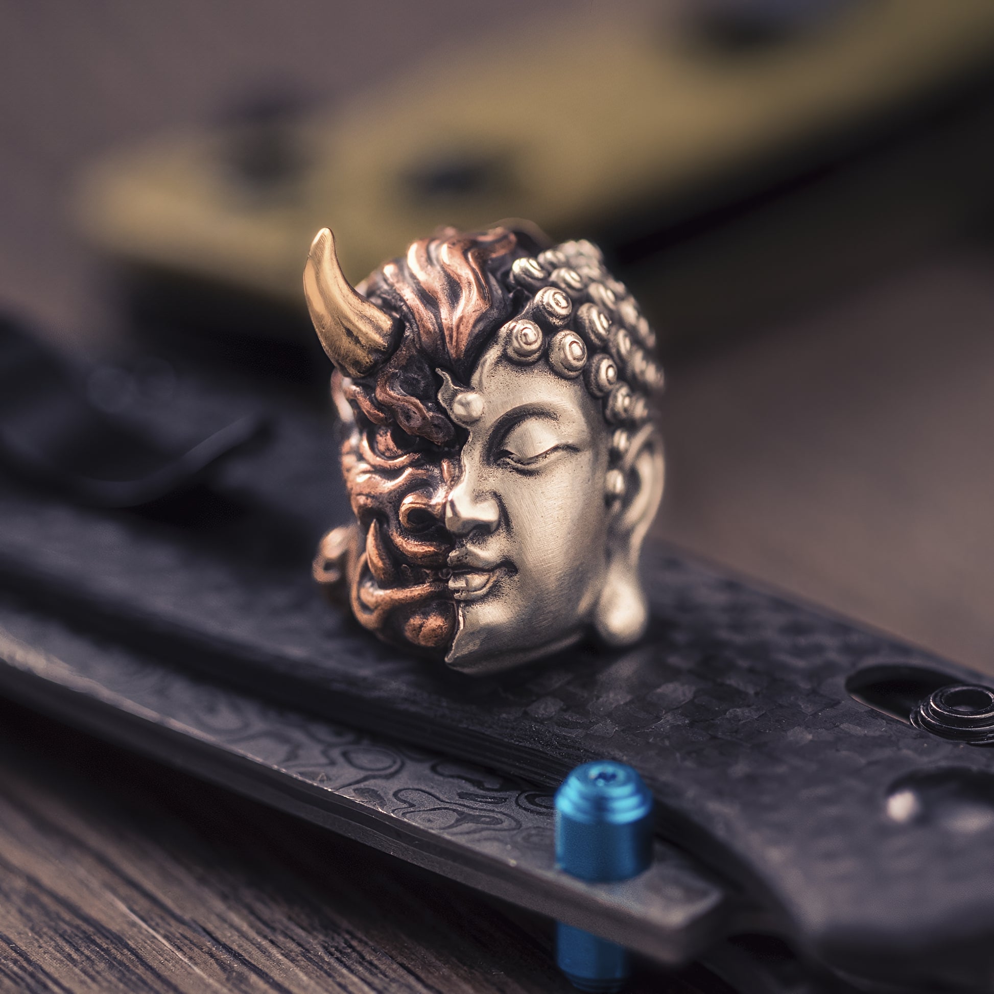 Buddha or Devil Paracord Bead three different metals edc — copper, brass, and white brass — fused together into a single