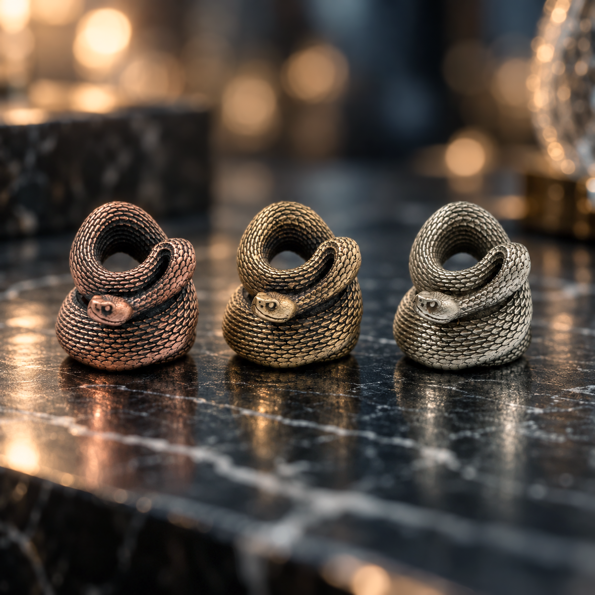 Brass, white brass and copper Rattlesnake paracord beads with hand-finished aged metal surfaces and detailed snake scales.