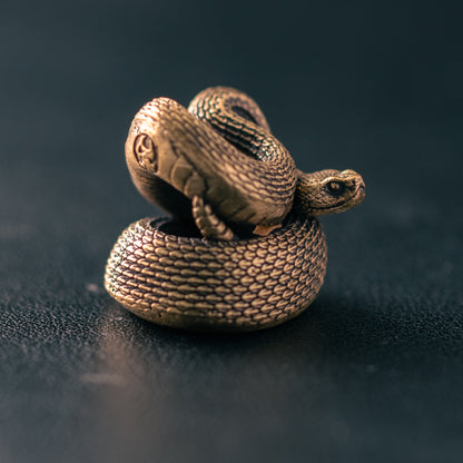 Antique brass rattlesnake paracord bead with detailed scales and coiled sculptural body, original ShadowEDC EDC lanyard bead.
