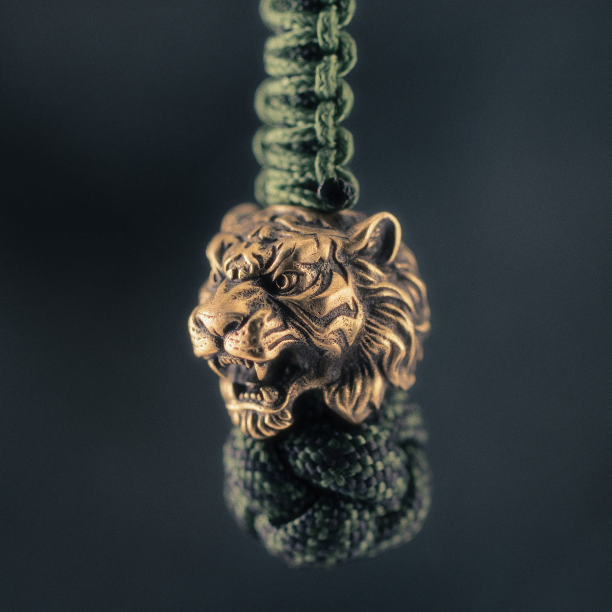 Antique brass Wild Tiger paracord bead with open jaws, sculpted stripes and detailed fur, original ShadowEDC EDC lanyard bead.